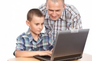 Father and son at the computer